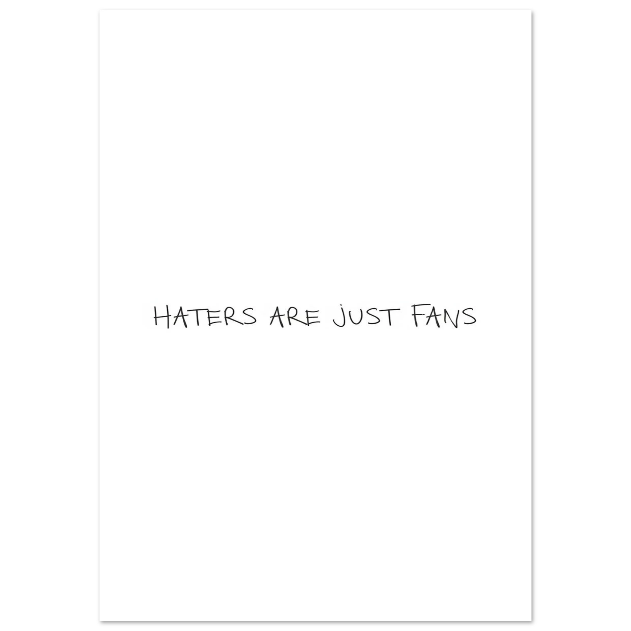Unframed poster with centered black text, “HATERS ARE JUST FANS”.