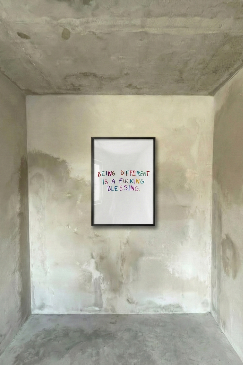 Black framed typography poster with handwritten quote in red, blue, and teal.