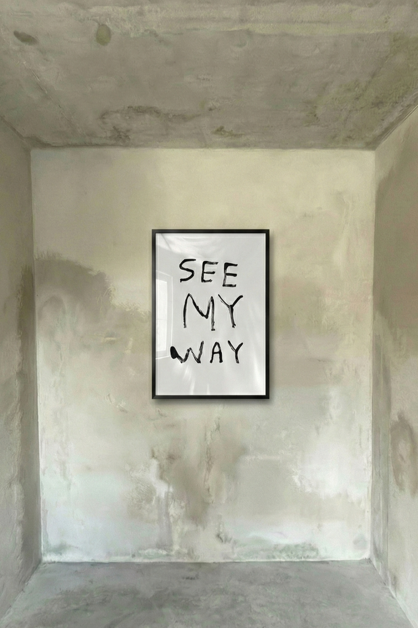Framed handwritten text poster with black lettering on white, black frame