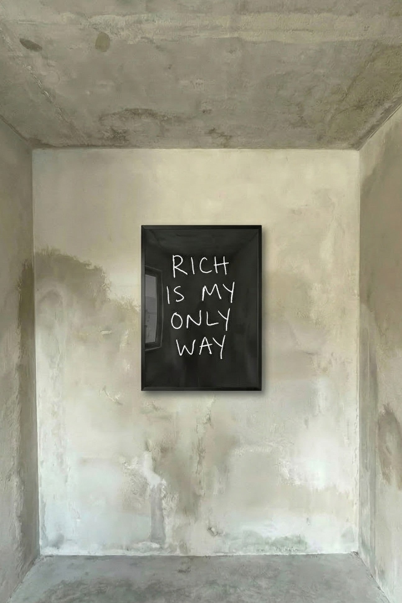 Black framed wall poster with white hand-lettered text: “RICH IS MY ONLY WAY”