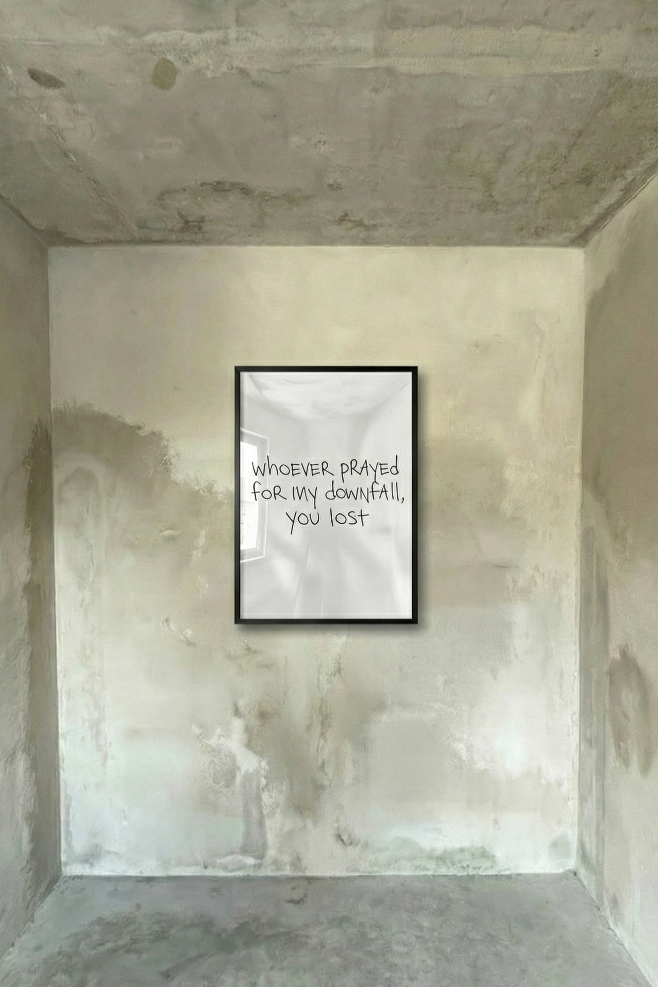 Framed poster with handwritten-style black text on light background, in a dark frame